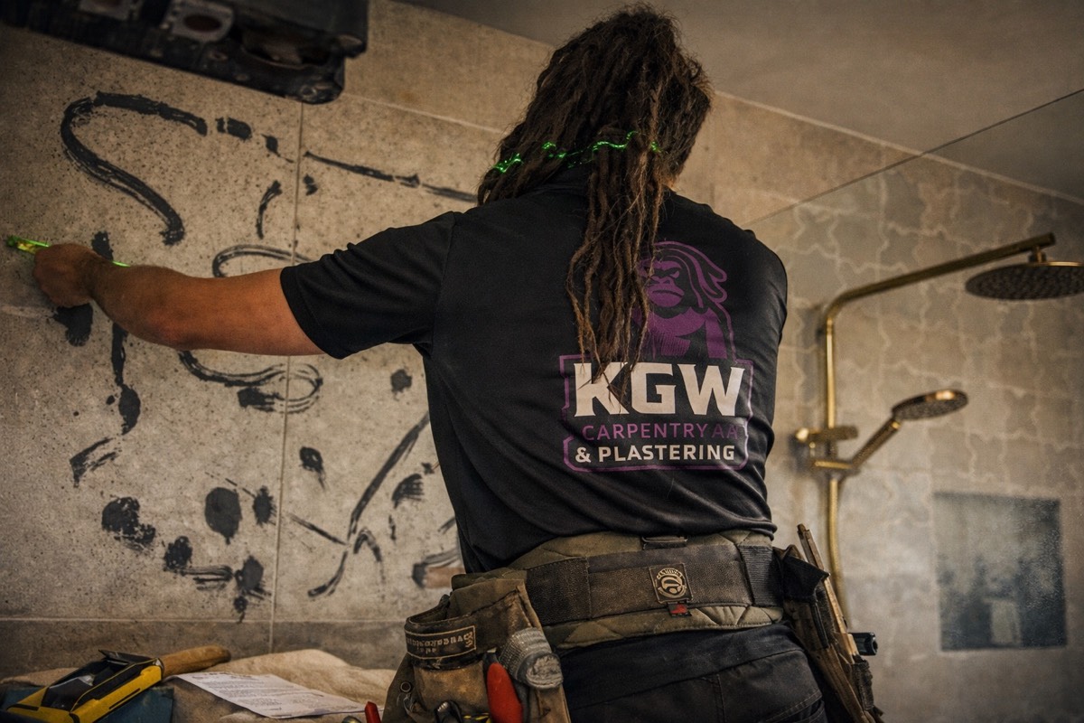 Kevin measuring up a bathroom wall in Toowoomba, bathroom renovation by KGW