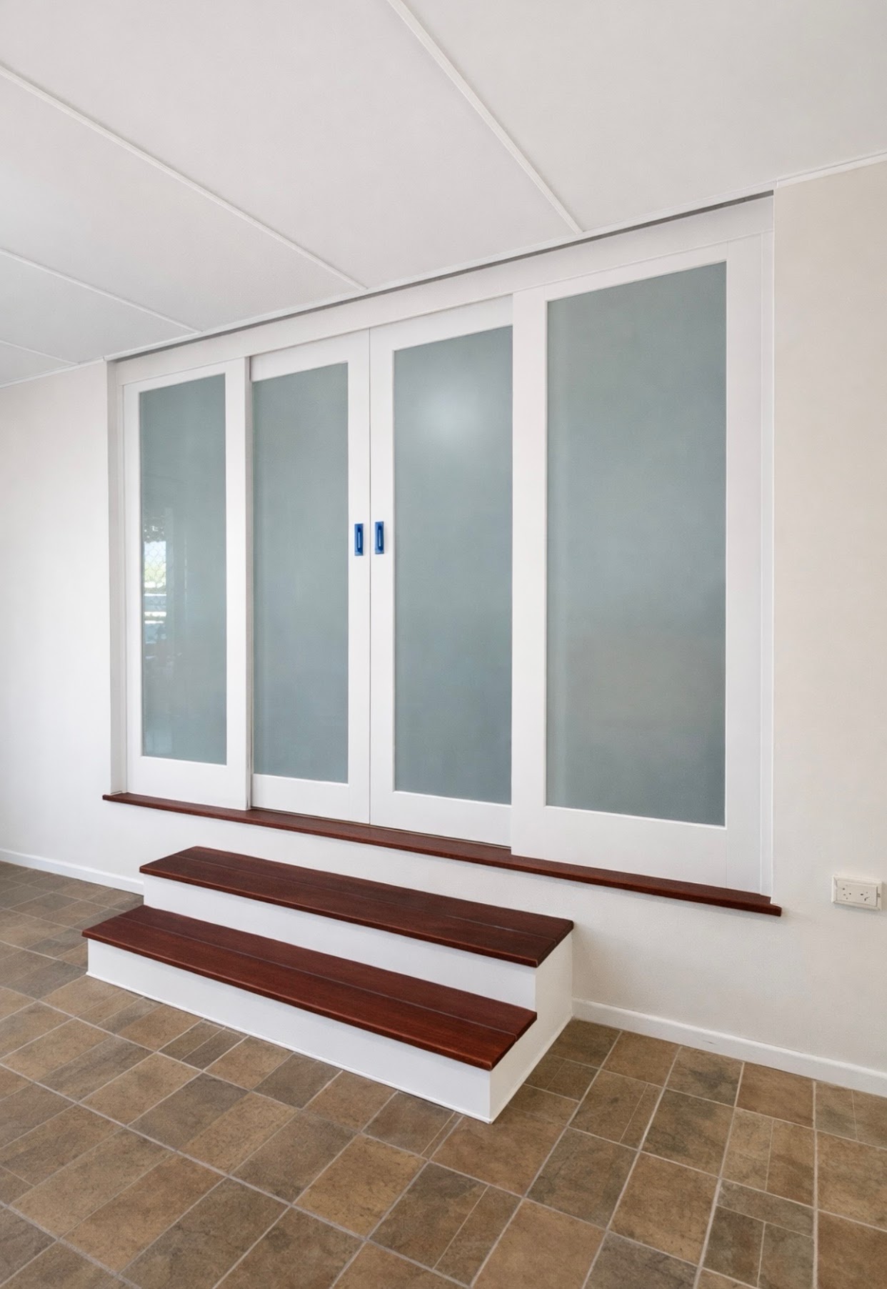 After - Custom glass sliding doors and Jarrah stairs installed by KGW Carpentry Toowoomba